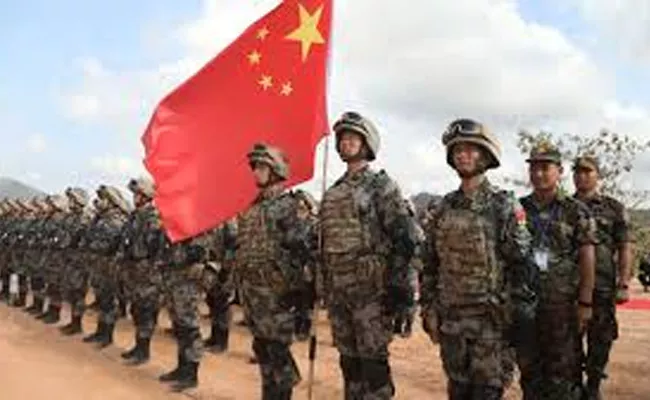 China of amassing troops along border in violation of agreements - Sakshi