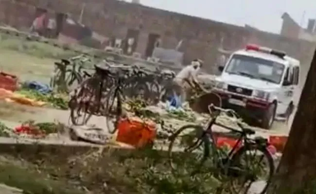 UP Cop Suspended Crushes Vegetables With Police Car - Sakshi