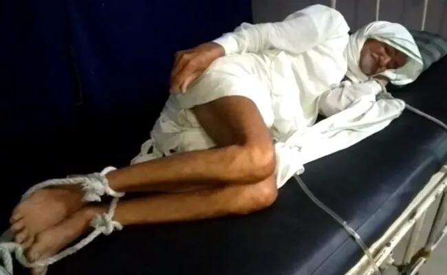 Elderly Man Tied To Madhya Pradesh Hospital Bed - Sakshi