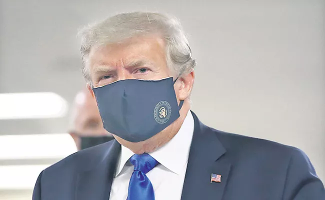 US President Donald Trump wears face mask for the first time - Sakshi