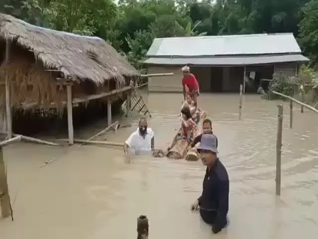  Assam MLA Goes into Water to Rescue People and Livestock Video