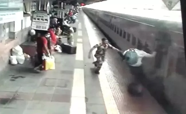 Alert Security Personnel Save Man From Being Crushed By Train Near Mumbai - Sakshi