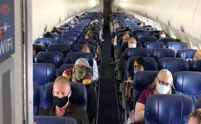 You have To Wear A Mask On A Plane Says US Airlines - Sakshi