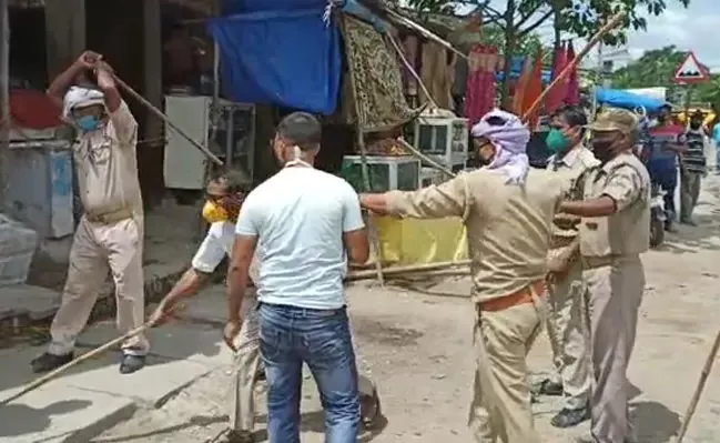 UP Official Thrashed Mask Clad Men During Checking Drive - Sakshi