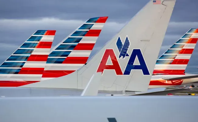 COVID19American Airlines plans to cut 40000 jobs in October - Sakshi