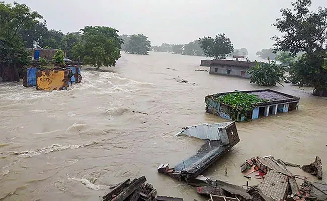 Bihar: 21 Dead Due To Floods Over 69 Lakh People Affected - Sakshi