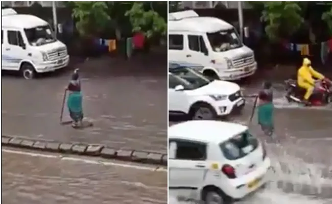 Mumbai Woman Stands Beside Open Manhole For 5 Hours To Warn Commuters - Sakshi