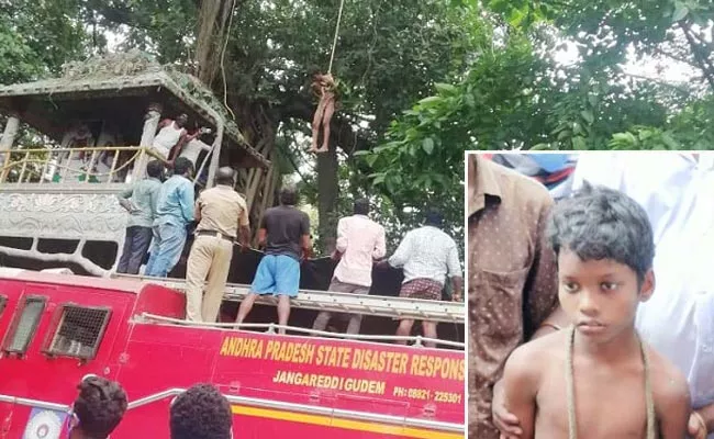 Boy Climbed Tree And Made Hul chul In West Godavari - Sakshi