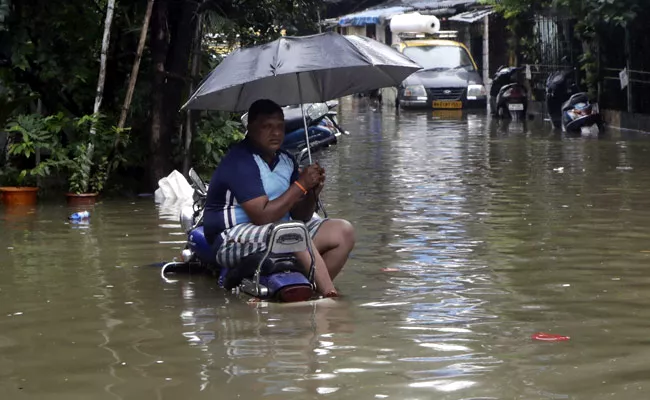 Mumbai Flooded After Heavy Overnight Rain IMD Warning - Sakshi