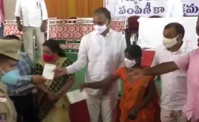 Minister Harish Rao Distributed Pass Books To More than 500 families - Sakshi