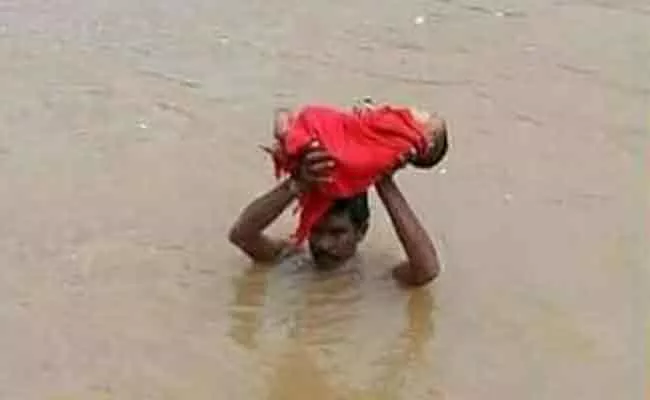 Fake Viral Photo Of Man Crossing Rivulet And Carrying Toddler In Asifabad - Sakshi