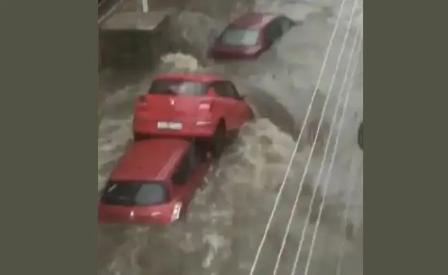 Cars Float, Swept Away As Hyderabad Faces Deluge video viral - Sakshi