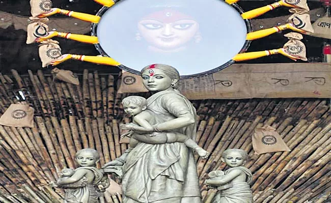 Statue Of Durga Mata In Form Of Migrant Working Woman - Sakshi