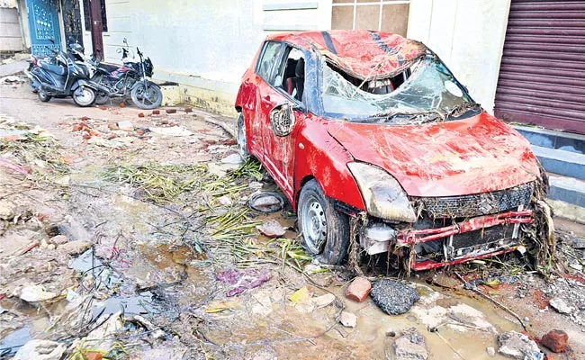 Rains In Hyderabad, Two Wheelers Vehicles Submerged In Flood Waters - Sakshi