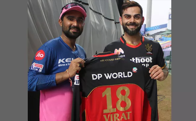 Virat Kohli Gifted A Special Autographed Jersey To Rahul Tewatia - Sakshi