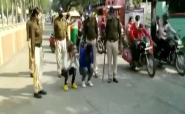 Video: Two Held For Harassing Women In MP Squats On Busy Road - Sakshi