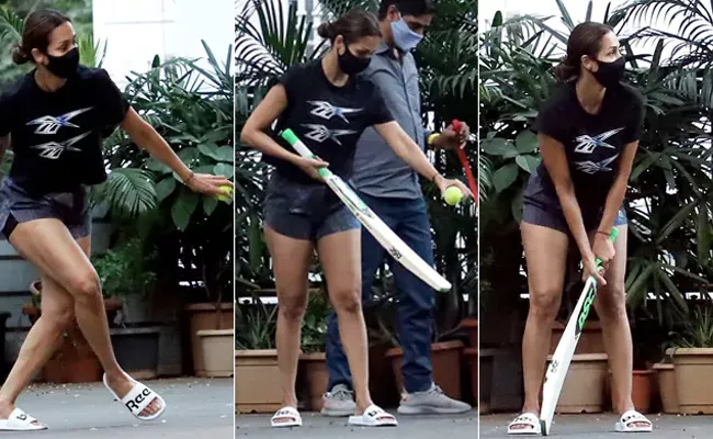 Pics Of Malaika Arora Playing Cricket With Son Arhaan - Sakshi