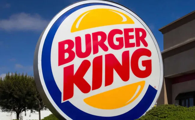 Burger king lists with huge premium in NSE and BSE - Sakshi