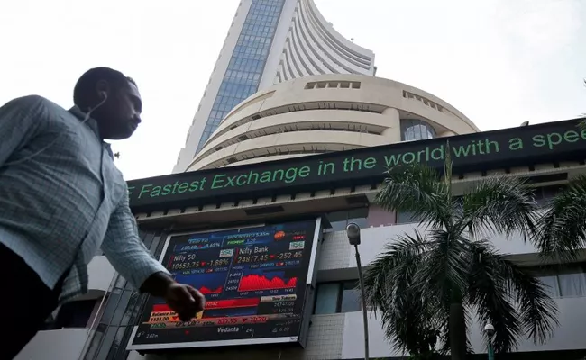 Market ends flat despite volatile session - Sakshi