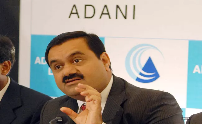 Total to acquire 20pc stake in Adani Green Energy - Sakshi