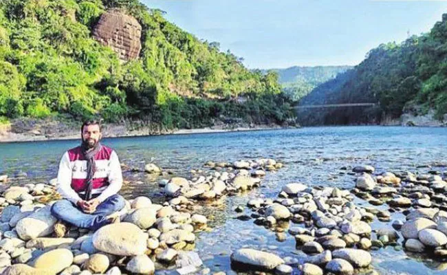 East Godavari Man Travelling Around Country With Bike - Sakshi