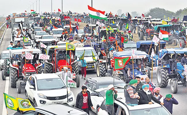 Farmers take out tractor march against farm laws - Sakshi