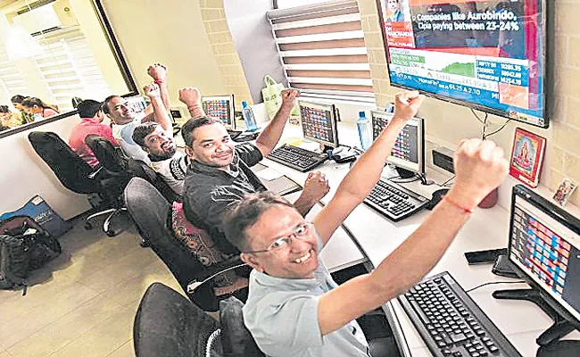 Sensex jumps 689 points and Nifty settles above 14,300 points - Sakshi