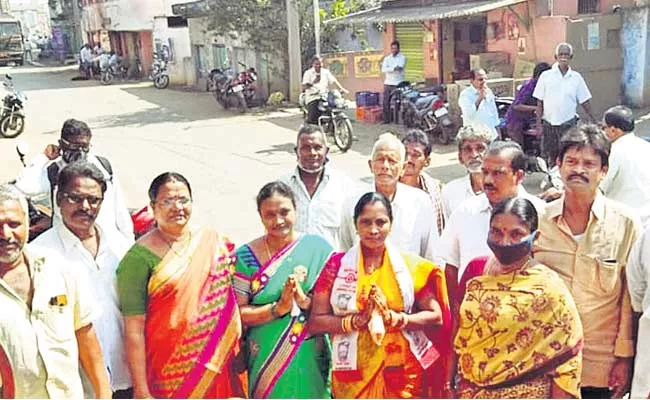 Sarpanch Candidate Campaigning Wearing Two Party Scarves - Sakshi