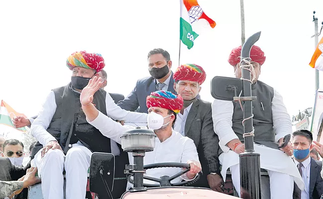 Rahul Gandhi Drives Tractor at Farmers Rally in Rajasthan - Sakshi