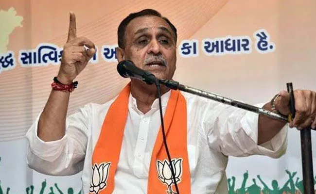  Gujarat CM Vijay Rupani faints on stage at poll rally in Vadodara - Sakshi