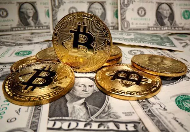 Bitcoin Vaults Above 50,000 Dollars For First Time Ever - Sakshi