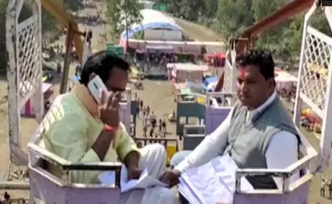 Madhya Pradesh Minister Climbs 50 Foot Swing High For Phone Signal - Sakshi