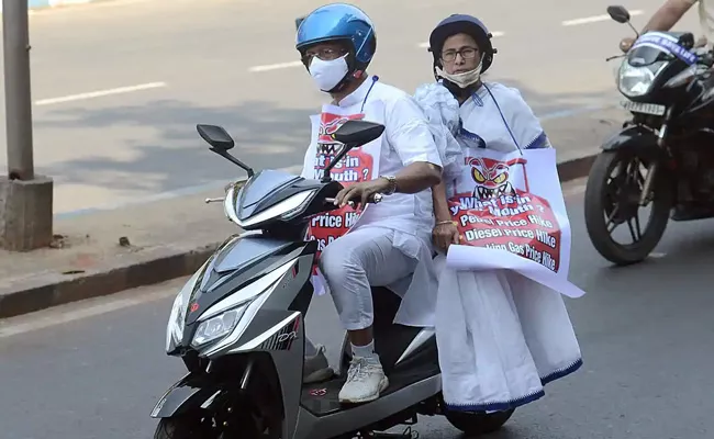 Mamata Banerjee Rides Electric Scooter to Protest Against Rising Fuel Price - Sakshi