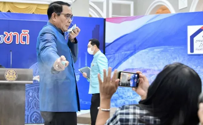 Thailand PM Sprays Reporters With Hand Sanitiser - Sakshi