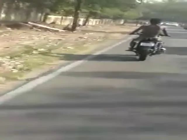 A bike rider Halchal in Hyderbad public roads police looking 