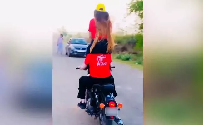 Two Women Bike Stunt Fine 28,000 After Instagram Video Viral - Sakshi