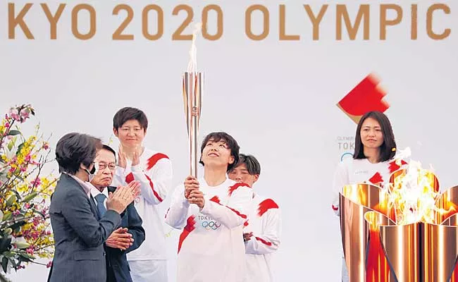 Olympic flame starts its final leg to Tokyo - Sakshi