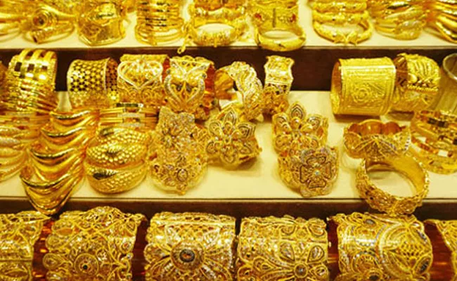 Gold prices drop: Yellow metal Rs 12000 falls from its all-time high  - Sakshi