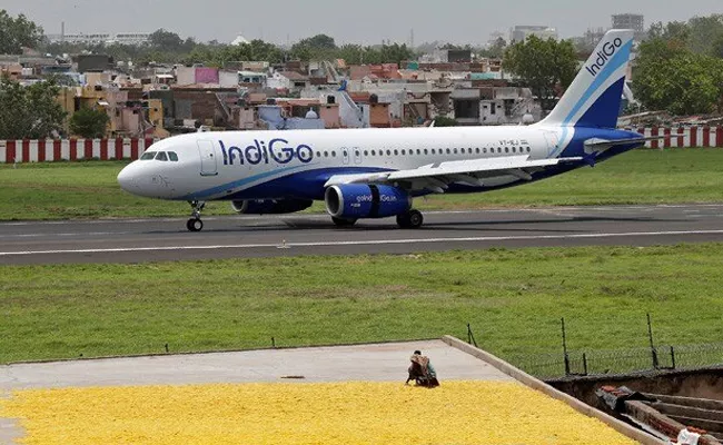 Pilot cancels takeoff after IndiGo passenger says he COVID positive - Sakshi