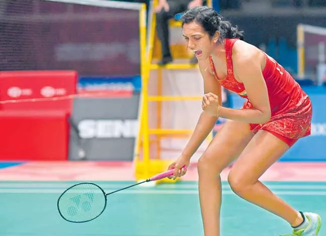 PV Sindhu sets up blockbuster final against Carolina Marin - Sakshi