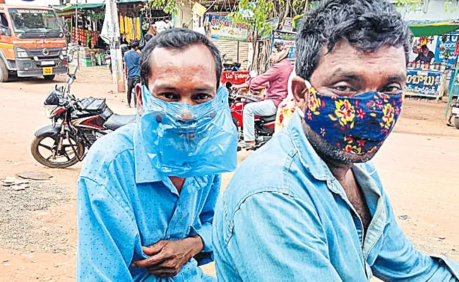 Man Wearing Cover As Mask For Escaping Fine Mulugu District - Sakshi