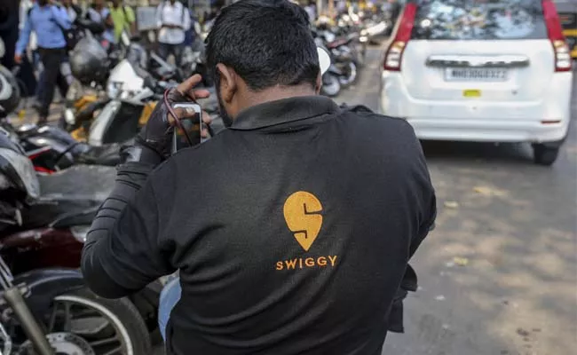 SoftBank looking to invest usd 450 million in Swiggy - Sakshi