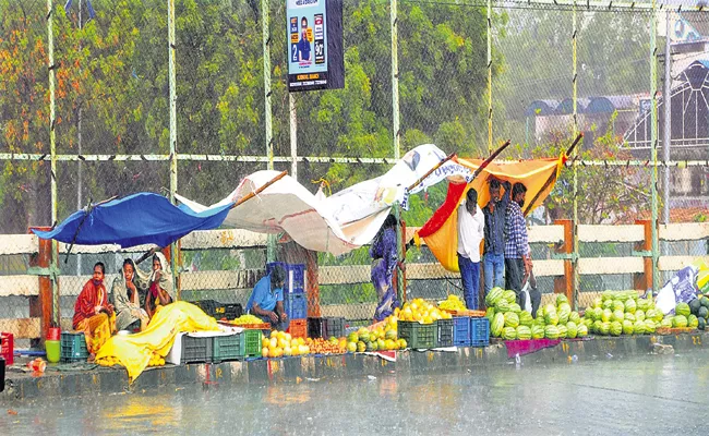 Rained with gusts on Friday evening in several places across AP - Sakshi