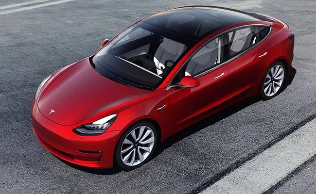 Tesla looking to open showrooms in 3 cities in India - Sakshi