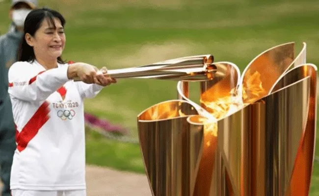 Tokyo Olympics Torch Relay Pulled Off In Hiroshima Streets - Sakshi