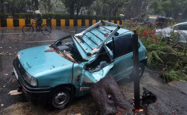 How Cyclone Tauktae Pummeled Pandemic Hit City - Sakshi