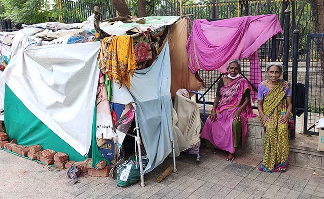 Old People Live At Footpath At Basavatarakam Cancer Hospital KBR Park - Sakshi