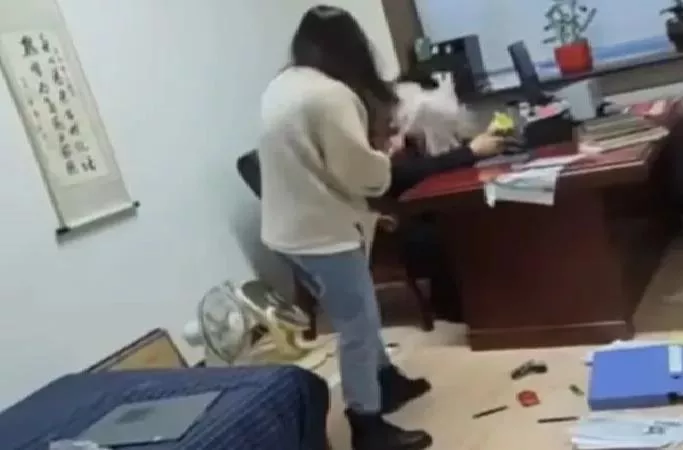 Chinese Woman Beats Boss With Mop After He Harasses Her - Sakshi