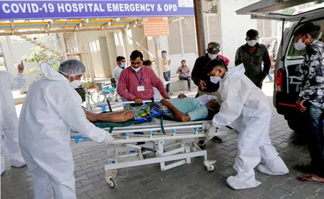 India reports 4,12,262 new Covid-19 cases, 3,980 deaths in 24 hours - Sakshi