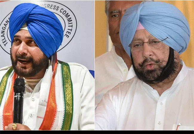 Punjab Congress Poster War Erupts Between Navjot Singh Sidhu And Amarinder Singh - Sakshi